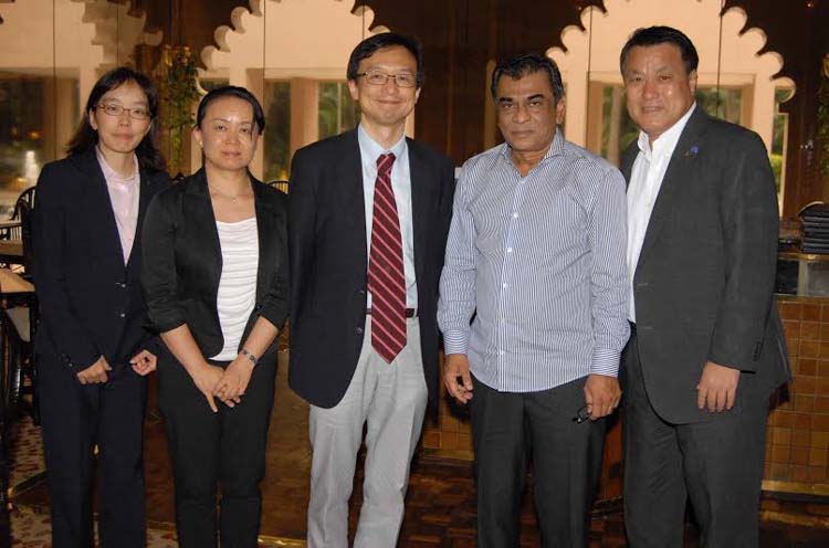 President of Bangladesh Football Federation Kazi Salahuddin and the officials of Japan Football Association pose for a photo session after the press conference at the Pan Pacific Sonargaon Hotel on Tuesday.