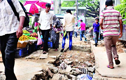 Who cares! Repair work on busy Topkhana Road remained unattended despite immense sufferings to commuters as well as locals for several months. This photo was taken on Tuesday.