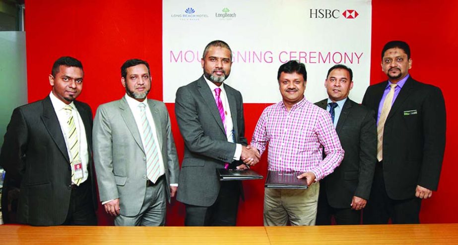 Sabbir Ahmed, Head of Retail Banking and Wealth Management of HSBC and Abul Kalam Azad, Managing Director of Long Beach Hotel Group, sign MoU recently. Selected customers of HSBC will get year-long discount on rooms, dining and spa facilities in Long Be