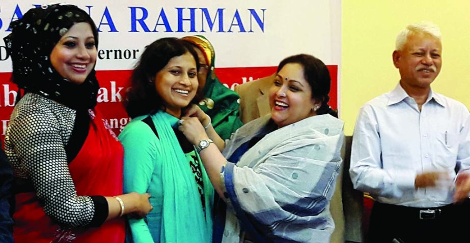 Rotary Governor Safina Rahman being greeted by Cosmopolitan Rotary members in the city on Tuesday as she was enlisted as new member of the Rotary.