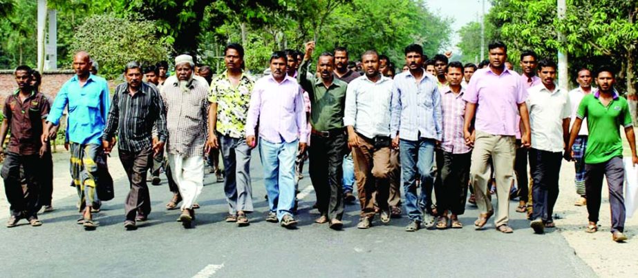 THAKURGAON: Workers of Kazi Farms Ltd , Thakurgaon brought out a procession at Salondor area protesting sacking of 5,000 workers within nine months on Wednesday.