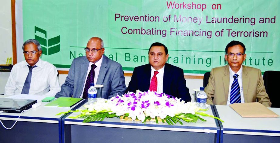 Shamsul Huda Khan, Managing Director & CEO of National Bank Limited inaugurating a day-long workshop on "Prevention of Money Laundering and Combating Financing of Terrorism" organized by the bank in the city recently. Syed Mohammad Bariqullah, Deputy Ma