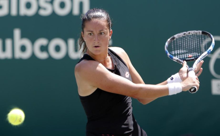 Lara Arruabarrena from Spain returns to Samantha Stosur during a match at the Family Circle Cup tennis tournament in Charleston, S.C.on Wednesday.