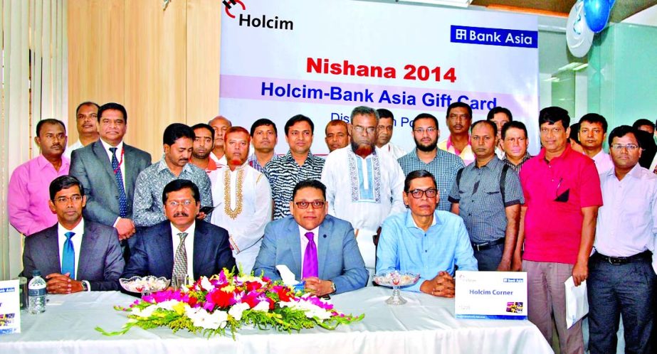 Sumanta Pandit, Managing Director of Holcim Bangladesh and Md Mehmood Husain, Managing Director of Bank Asia Ltd pose with the Holcim channel partners after launching Gift Cards as incentive at the principal office of the bank in the city on Wednesday.