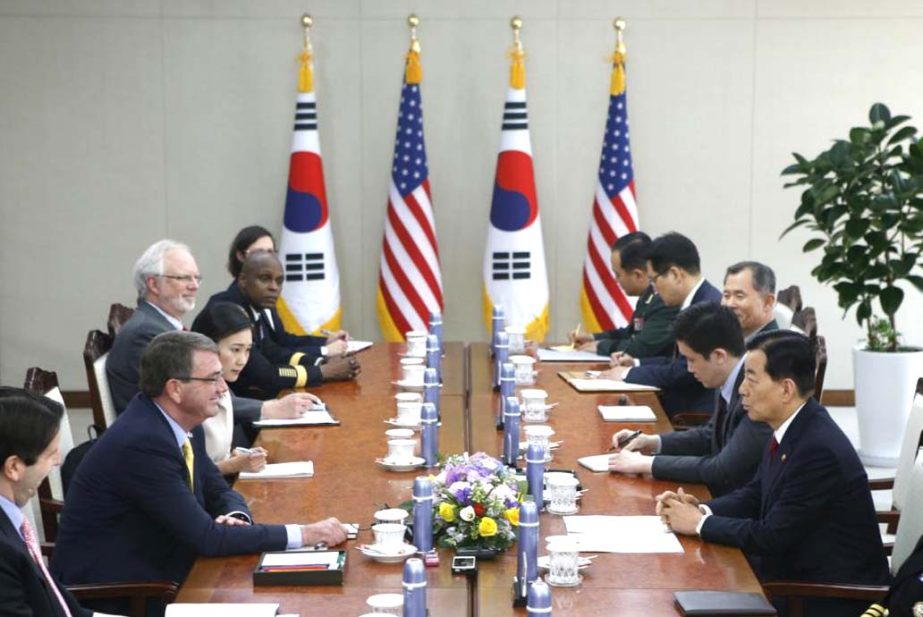 U.S. Defence Secretary Ash Carter, second left, talks with his South Korean counterpart Han Min Koo, right, during their meeting at the Defence Ministry in Seoul on Friday.,