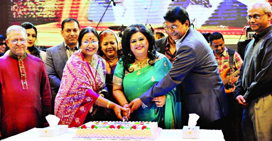 Legendary singer Runa Laila cutting cake marking the celebration of fifty years of her music career at the Hall of Fame of Bangabandhu International Conference Centre in the city on Friday night. Among others, her husband actor Alamgir and celebrated sing