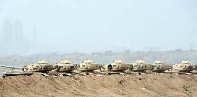 Saudi army tanks are deployed near the Saudi-Yemeni border.