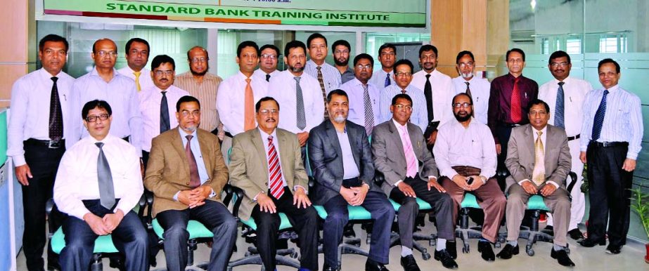 Mamun-Ur-Rashid, Deputy Managing Director of Standard Bank Limited, poses with the participants of a day-long workshop on "Managerial Competence Development" organized by the Training Institute of the bank at its auditorium recently. SA Chowdhury, a ban