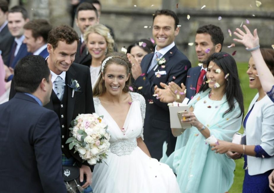 British tennis player Andy Murray and his new wife Kim Sears smile as they are showered in confetti after being married at Dunblane Cathedral in Scotland on Saturday.
