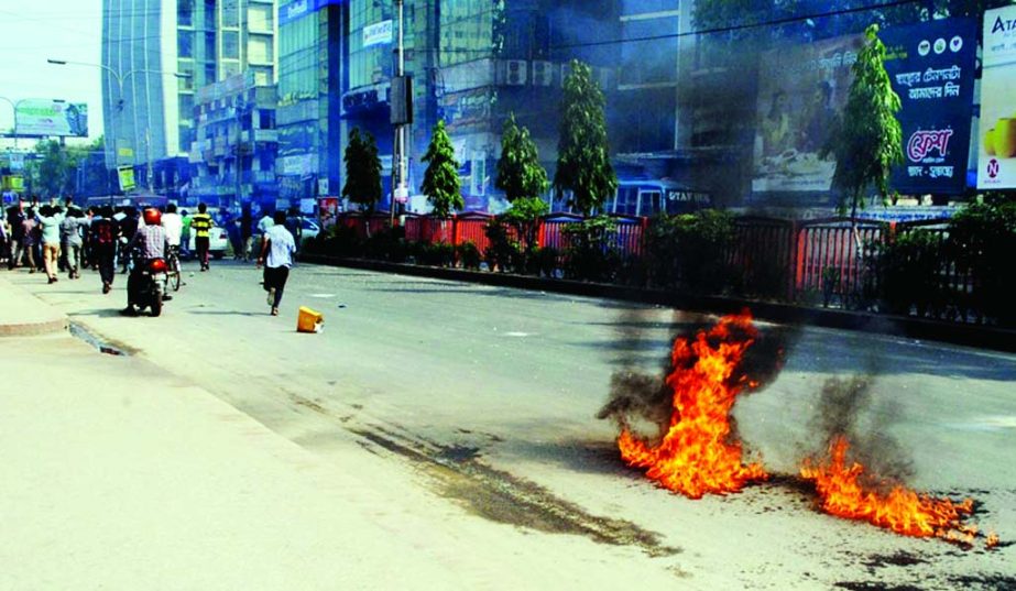Jamaat-Shibir activists set fire on the street by pouring petrol and vandalised vehicles in city's Sukrabad area on Sunday.