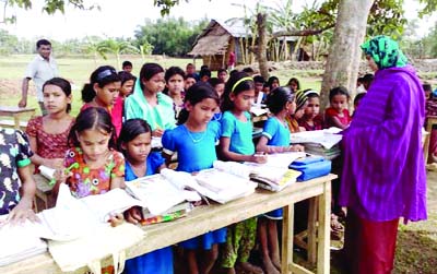 SUNAMGNAJ: Students of Bethakhai- Borokata Government Primary School in Surma Union are attending classes under the open sky as the school has been destroyed by north' westers. This picture was taken on Sunday.