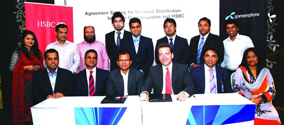 Dilip Pal, Chief Financial Officer of Grameenphone and Francois de Maricourt, CEO of HSBC Bangladesh, sign an agreement of dividend distribution mandate at GP head office on Sunday. HSBC will manage the dividend distribution service for the Grameenphone s