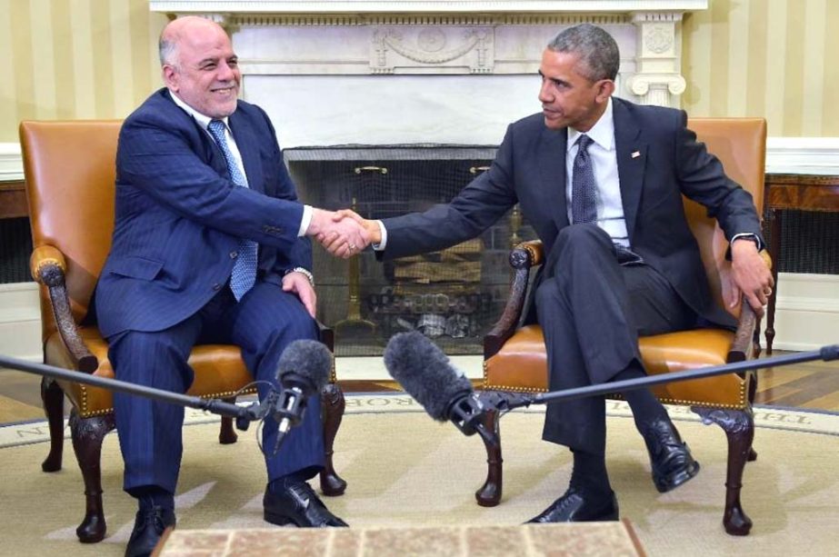 US President Barack Obama (R) shakes hands with Iraqi Prime Minister Haider al-Abadi during a bilateral meeting in the Oval Office on Tuesday.