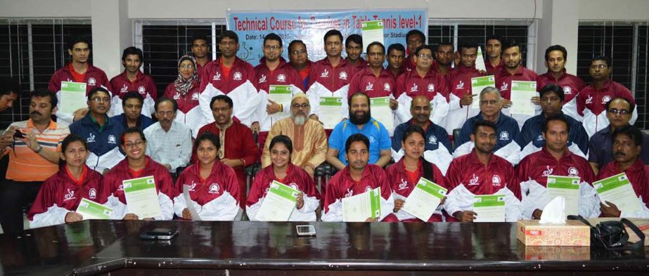 The participants of the International Table Tennis Level-1 Coaches Coaching Course pose with their certificates at the Shaheed Tajuddin Ahmed Wooden Floor Gymnasium on the concluding day (Wednesday).