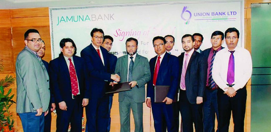 AKM Saifuddin Ahamed, DMD of Jamuna Bank and Syed Abdullah Mohammed Saleh, DMD of Union Bank exchanging MoU documents for disbursement of foreign remittance at Jamuna Bank's head office recently