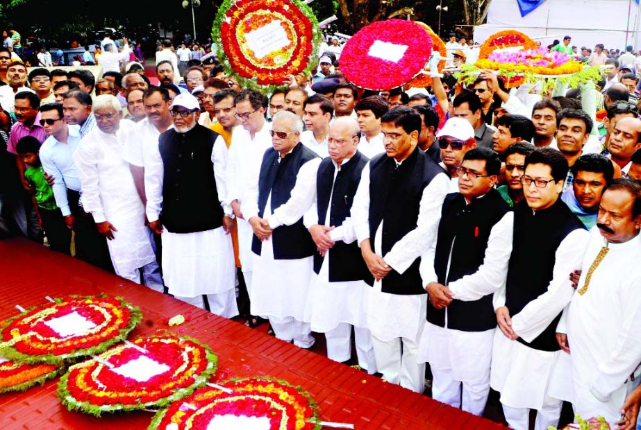 Awami League leaders stand in solemn silence after paying tributes to four national leaders and Liberation War martyred by placing floral wreaths at the memorial plaque at Mujibnagar in Meherpur on Friday marking historic Mujibnagar Day.