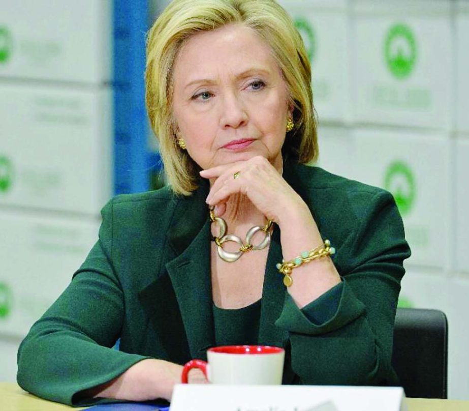 Democratic presidential hopeful Hillary Clinton participates in a small business roundtable discussion with members of the small business community on Thursday in Norwalk, Iowa.