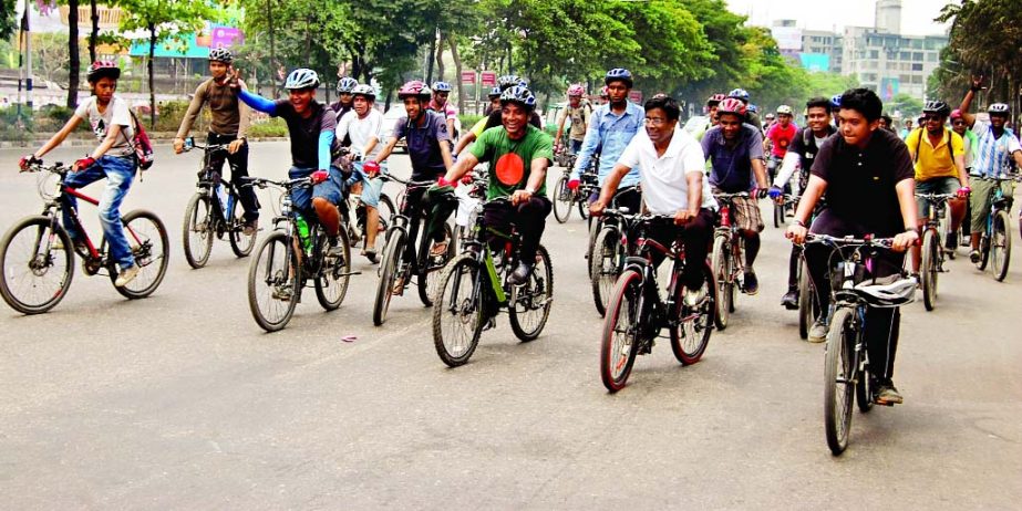 DNCC candidate Annisul Huq along with others cycling as a part of campaign on Friday.