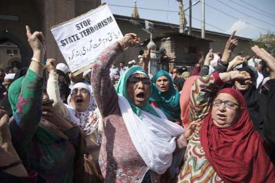 Supporters of Chairman of the All Parties Hurriyat Conference (APHC) Mirwaiz Umar Farooq shout freedom slogans during a protest in Srinagar, Indian controlled Kashmir.