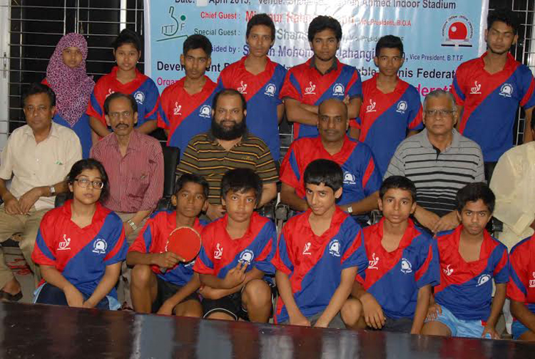 The participants of Under-13 Boys' & Girls' Table Tennis Coaching Course with the officials of Bangladesh Table Tennis Federation pose for photograph at the Shaheed Tajuddin Wooden Floor Gymnasium on Saturday.