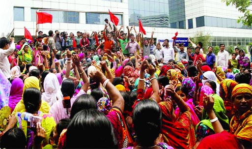 Swan Garment workers demonstrating in front of BGMEA Bhaban on Sunday in city demanding payment of salaries and other dues by the owners soon.