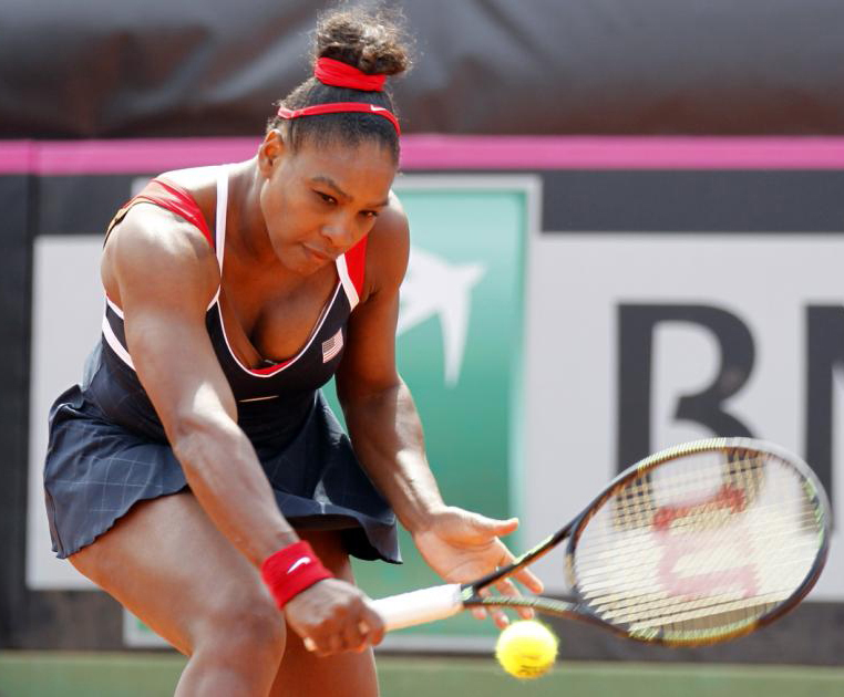 Serena Williams of United States returns the ball to Italy's Sara Errani during a Fed Cup World Group playoff tennis match in Brindisi, Italy on Sunday.