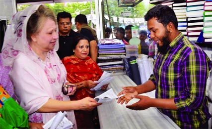 BNP Chairperson Begum Khaleda Zia campaigning for DNCC mayor aspirant Tabith Awal and distributing leaflets among the shopkeepers on Sunday.