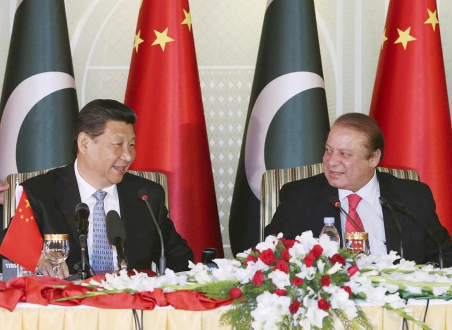 Chinese President Xi Jinping, left and Pakistan's Prime Minister Nawaz Sharif attend a press conference after their talks in Islamabad.