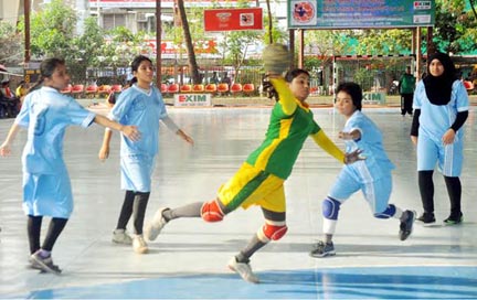 A moment of the match of the EXIM Bank 25th National Women's Handball Championship between Bangladesh Ansar & VDP team and Dhaka district team at the Shaheed (Captain) M Mansur Ali National Handball Stadium on Tuesday.