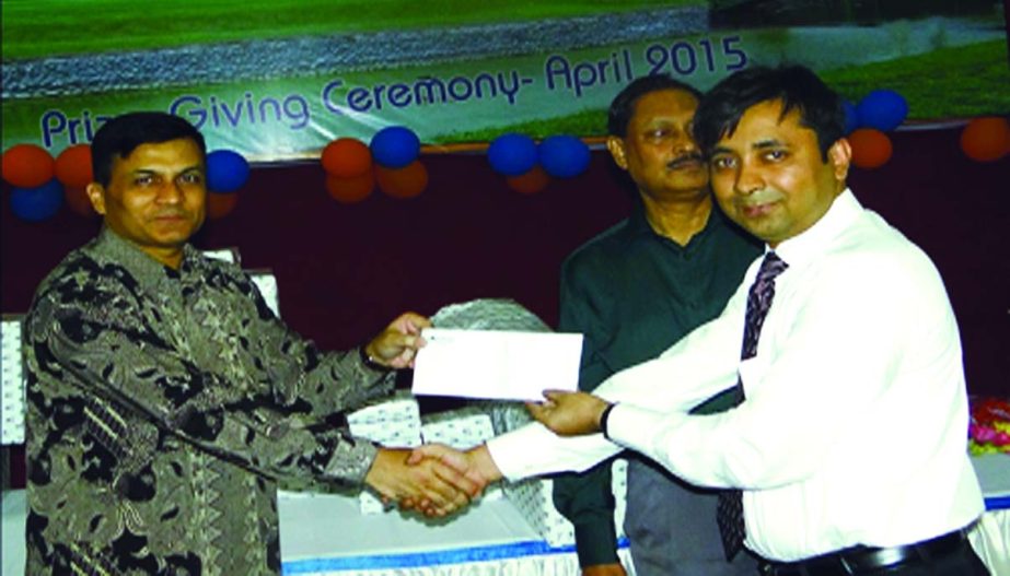 Major General Firoz Hasan, GOC of Ghatail Cantonment, Tangail receiving a cheque of Tk 5.00 lacs from SM Imran Alam, Head of Human Resources of Modhumoti Bank Limited, for specialized school 'Proyash-Ghatail Area' under the patronization of Bangladesh A