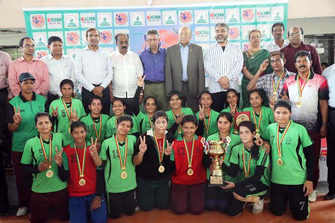 Members of BJMC, the champions of the EXIM Bank 25th National Women's Handball Championship with the guests and the officials of Bangladesh Handball Federation pose for a photo session at the Shaheed (Capt) M Mansur Ali National Handball Stadium on Wedne