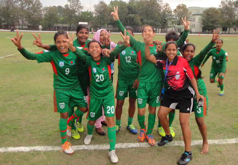 Players of Bangladesh National Under-14 Girls' Football team celebrate after defeating Bhutan National Under-14 Girls' Football team in the match of the AFC Under-14 Girls' Regional Championship at the Dashrath Stadium in Kathmandu, the capital city of