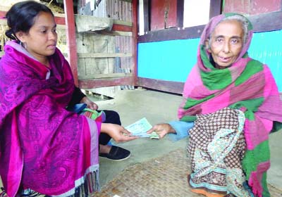 BETAGI(Barguna): Members of Jago Nari Jago, an NGO distributing Old Age Allowances at different areas in Betagi Upazila recently.