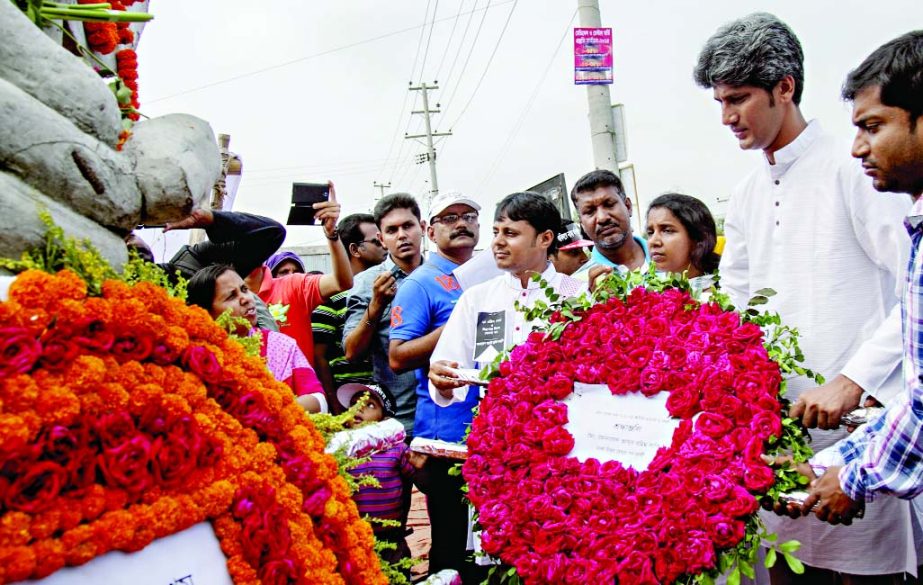 Ganotantrik Bam Morcha paid tributes to those who were killed in Rana Plaza collapse by placing floral wreaths in front of the Rana Plaza in Savar on Friday marking two years of the collapse.