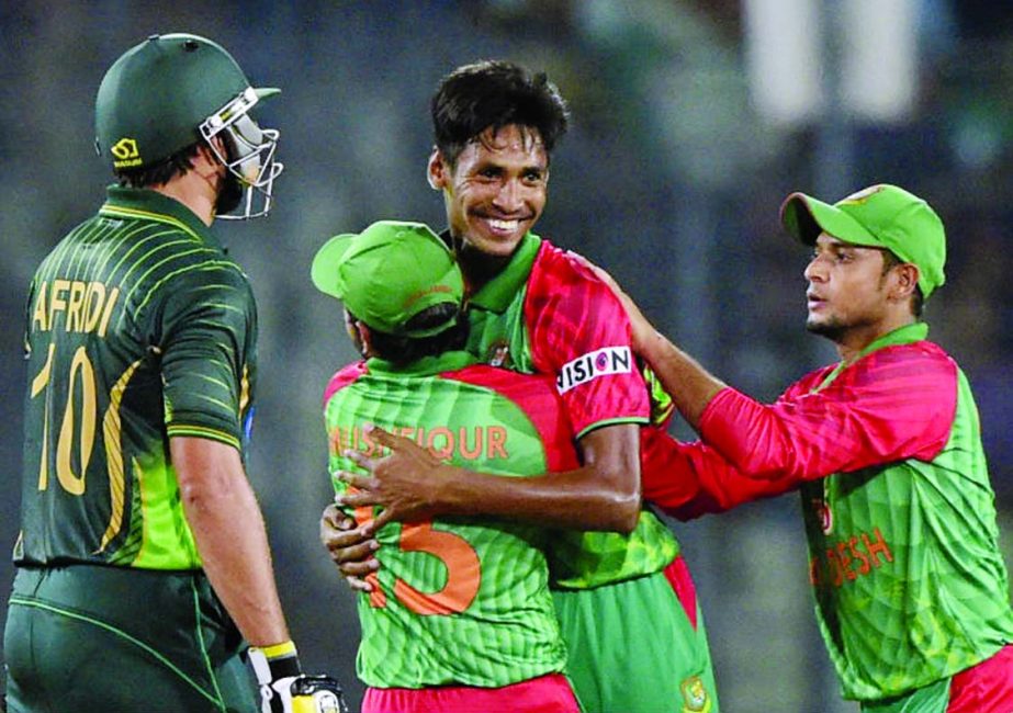Mustafizur Rahman is congratulated after dismissing Shahid Afridi during the Only T20I match between Bangladesh and Pakistan at the Sher-e-Bangla National Cricket Stadium on Friday.