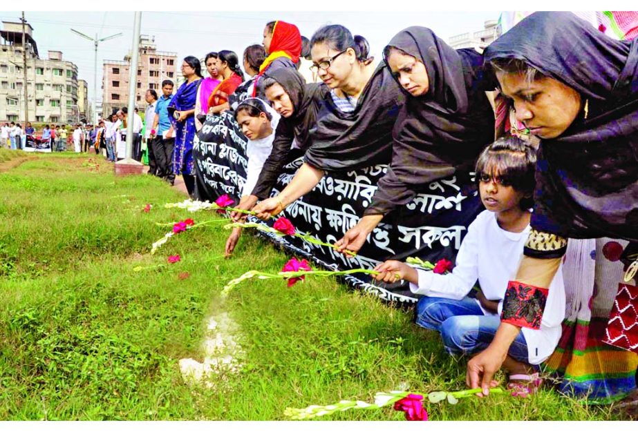 Relatives of Rana Plaza victims placed bouquet on the graves at Jurain marking the two-year of its tragedy on Friday.