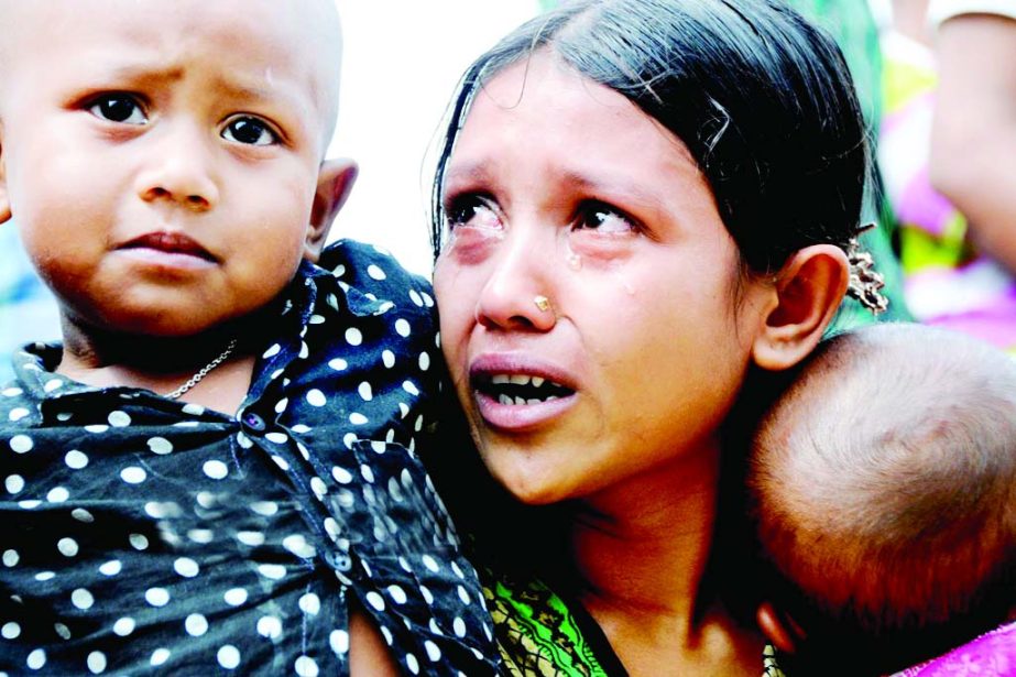 Tears rolling down the cheek of the family members of the victims of Rana Plaza even after two years as they visited the tragic spot at Savar on Friday marking the second anniversary of the shocking incident.