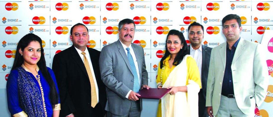 Syed Mohammad Kamal, Country Manager of MasterCard Bangladesh and Maliha M Quadir, Managing Director of shohoz.com inks a deal on Saturday to provide 10 per cent discount to all MasterCard debit or credit cardholders purchasing bus tickets through shohoz