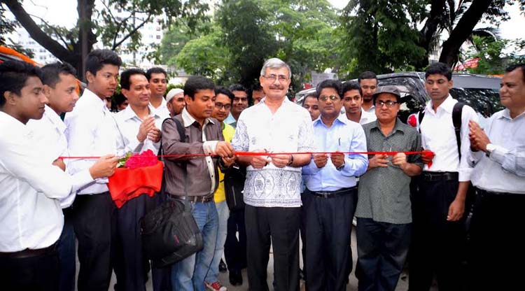 Secretary of the Ministry of Civil Aviation and Tourism Khorshed Alam Chowdhury inaugurating the Dhaka-Cox's Bazar-Dhaka Package Tour by cutting the Ribon in front of the National Press Club on Saturday. The Package Tour has been started ahead of the Nat