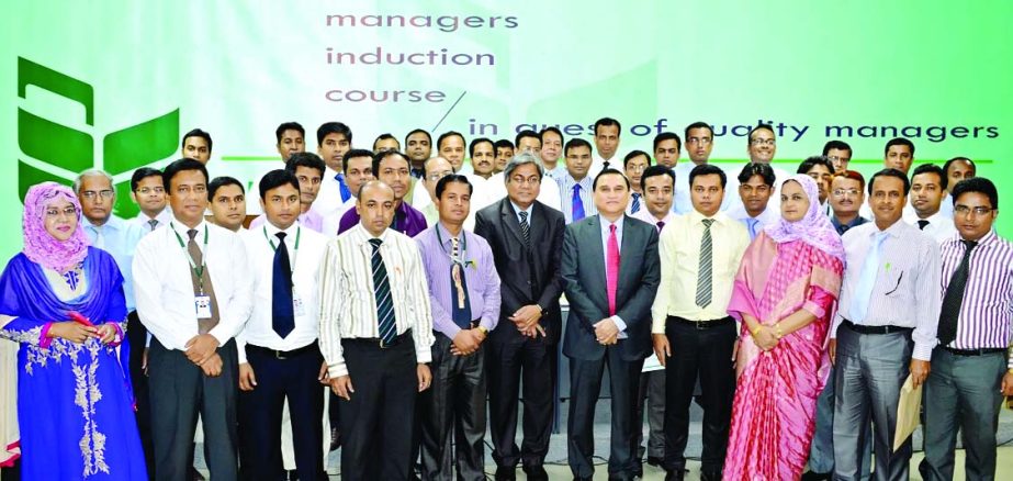 Shamsul Huda Khan, Managing Director of National Bank Limited, poses with the participants of a 'Managers Induction Course' at the bank's training institute recently.