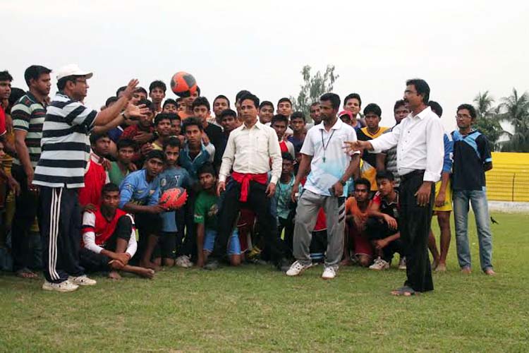The participants of the four-day long rugby players' coaching course, the coaches and the officials of Rangpur District Sports Association pose for a photograph at the Rangpur Stadium on Sunday.