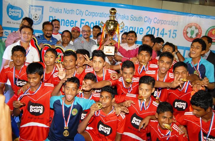 Members of Bangladesh Ansar & VDP (Dhaka Range), the champions of the Dhaka North City Corporation and Dhaka South City Corporation Pioneer Football League with the chief guest Deputy Minister for Youth and Sports Arif Khan Joy and the officials of BFF po