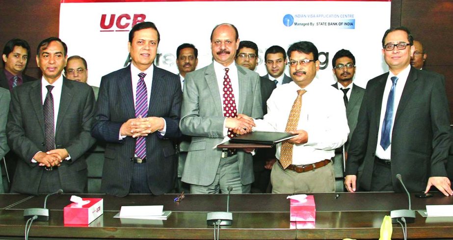 Mirza Mahmud Rafiqur Rahman, Additional Managing Director of United Commercial Bank Limited and Shankar Prasad Bala, Head of IT of State Bank of India sign an agreement recently for payment of Indian Visa Fee using UCash, mobile financial services of UCB.