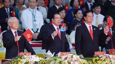 Communist Party Chief Nguyen Phu Trong (L), former Communist Party Chief Nong Duc Manh (C) and Prime Minister Nguyen Tan Dung watch a parade marking the 40th anniversary of the fall of Saigon, in Ho Chi Minh City on Thursday.