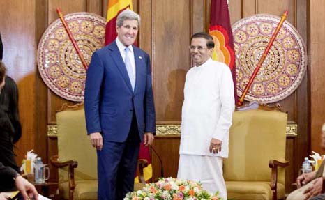 US Secretary of State John Kerry (centre L) poses with Sri Lankan President Maithripala Sirisena at the Presidential Secretariat in Colombo on Saturday.
