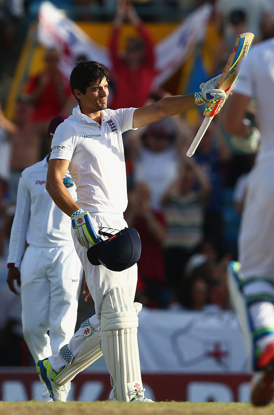 Alastair Cook celebrates his 26th Test hundred on the 1st day of 3rd Test between West Indies and England at Bridgetown on Friday.