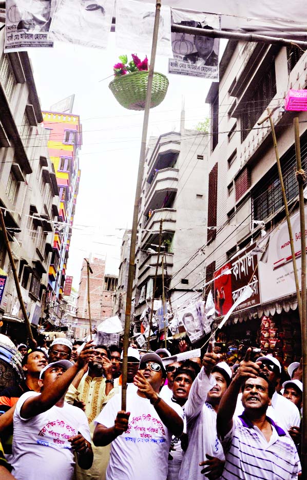 A team of DSCC led by new Mayor-elect Sayeed Khokan starts drive to clean the city at Nazira Bazar area on Saturday.