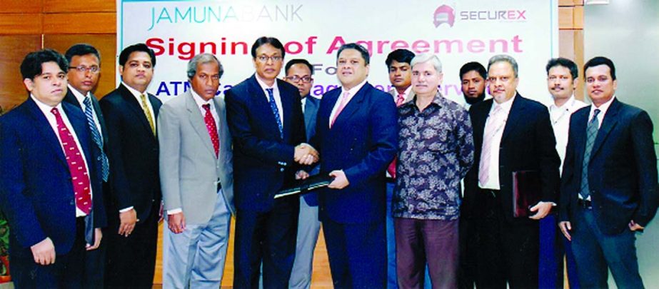 AKM Saifuddin Ahamed, Deputy Managing Director of Jamuna Bank Limited and Farhan Quddus, Managing Director of Securex sign an agreement at bank's head office recently to avail direct cash loading facilities in all ATMs of JBL from Securex Limited.