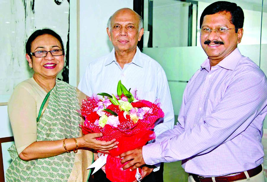 Md Mehmood Husain, Managing Director and Aminul Islam, Additional Managing Director of Bank Asia Ltd, congratulating Zakia Rouf Chowdhury with bouquet for being elected as Chairman of Reliance Insurance Company Limited recently.