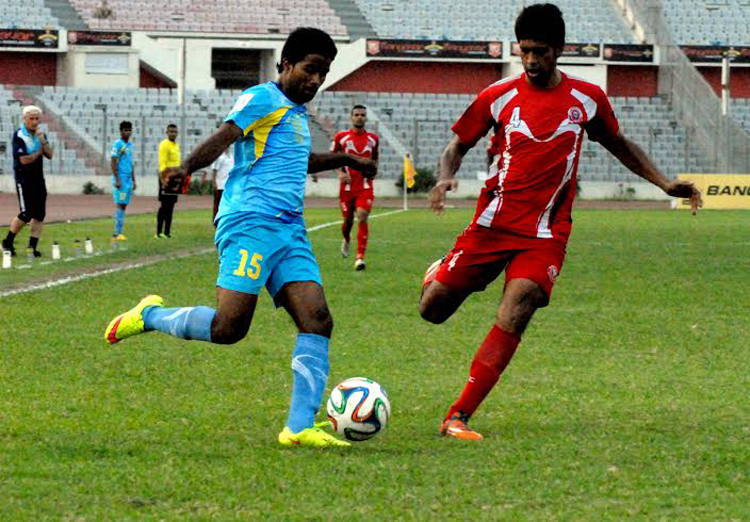 An action from the football match of the Manyavar Bangladesh Premier League between Bangladesh Muktijoddha Sangsad Krira Chakra and Dhaka Abahani Limited at the Bangabandhu National Stadium on Tuesday.